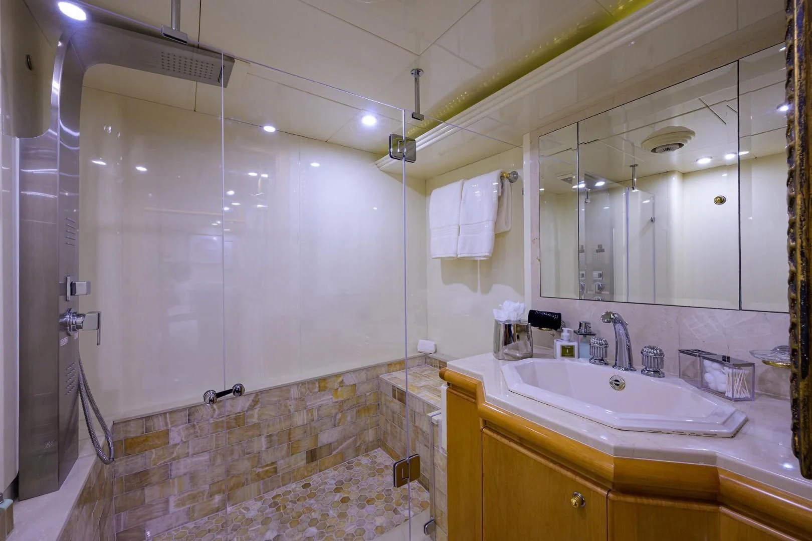 a bathroom with a large mirror aboard CABERNET Yacht for Sale