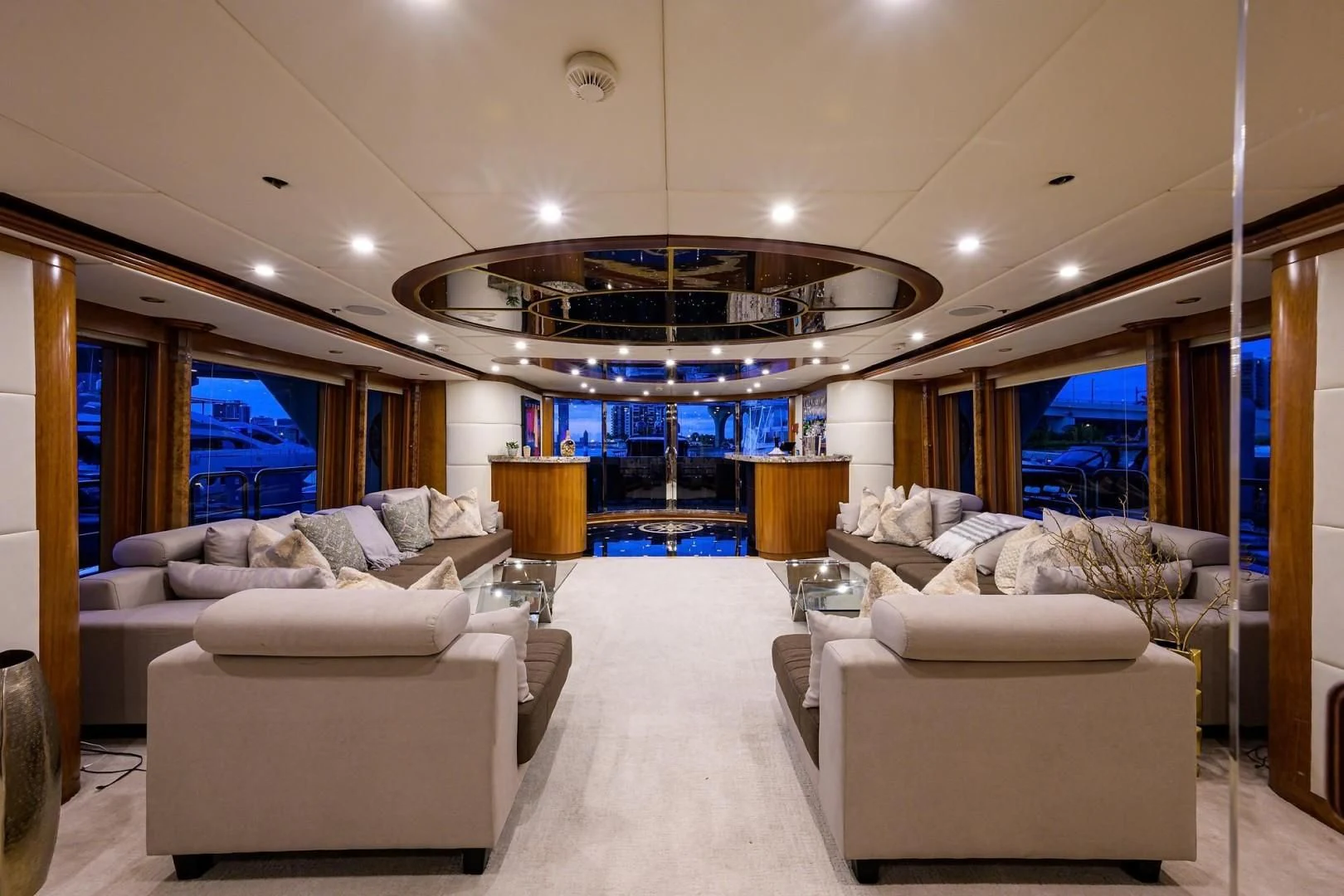 a living room with white couches aboard CABERNET Yacht for Sale