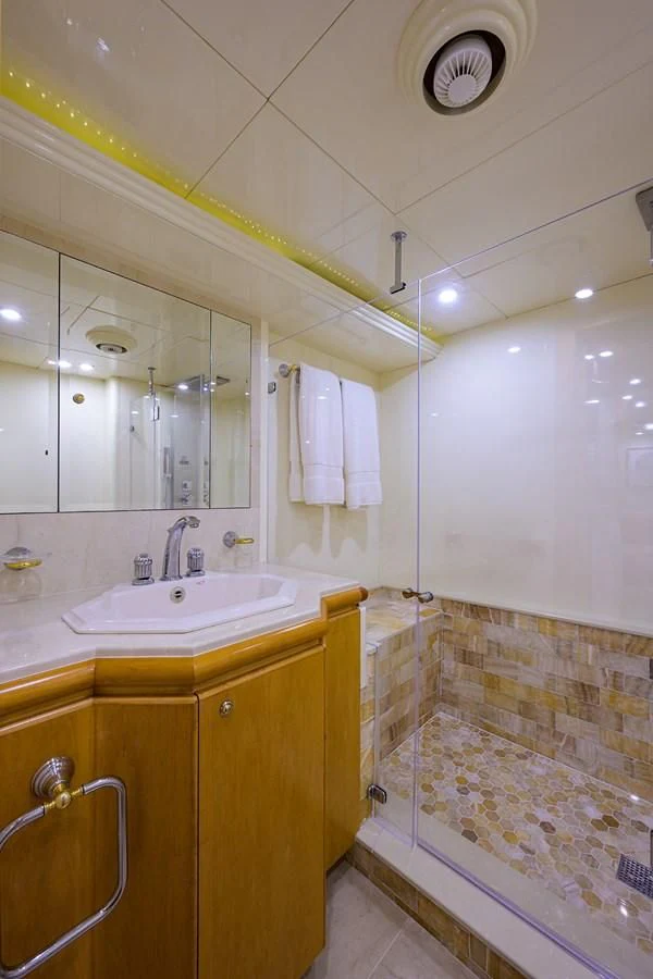 a bathroom with a sink and a mirror aboard CABERNET Yacht for Sale