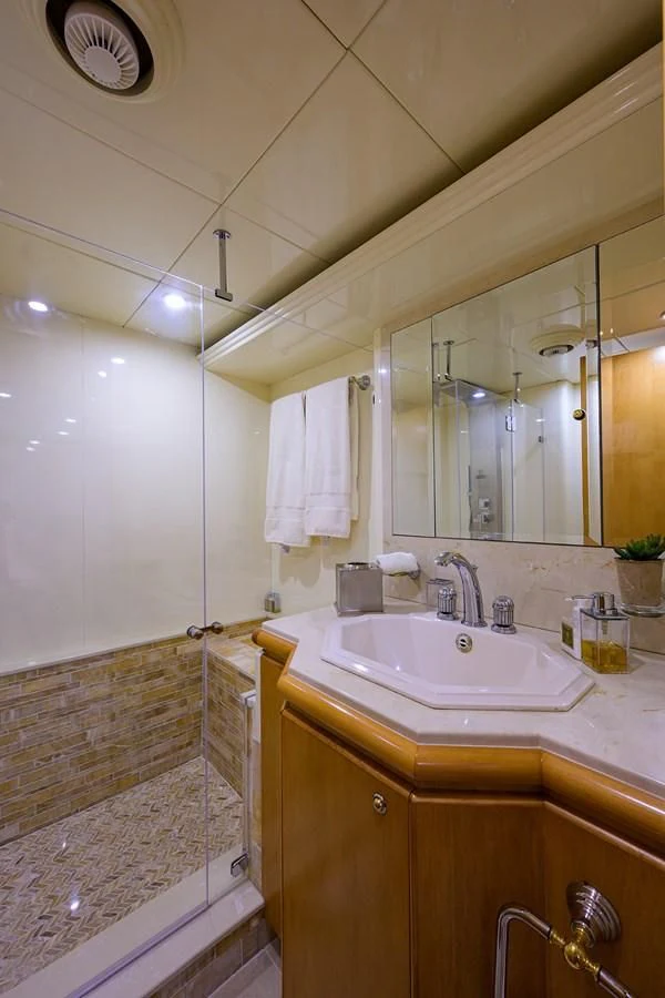 a bathroom with a sink and a mirror aboard CABERNET Yacht for Sale