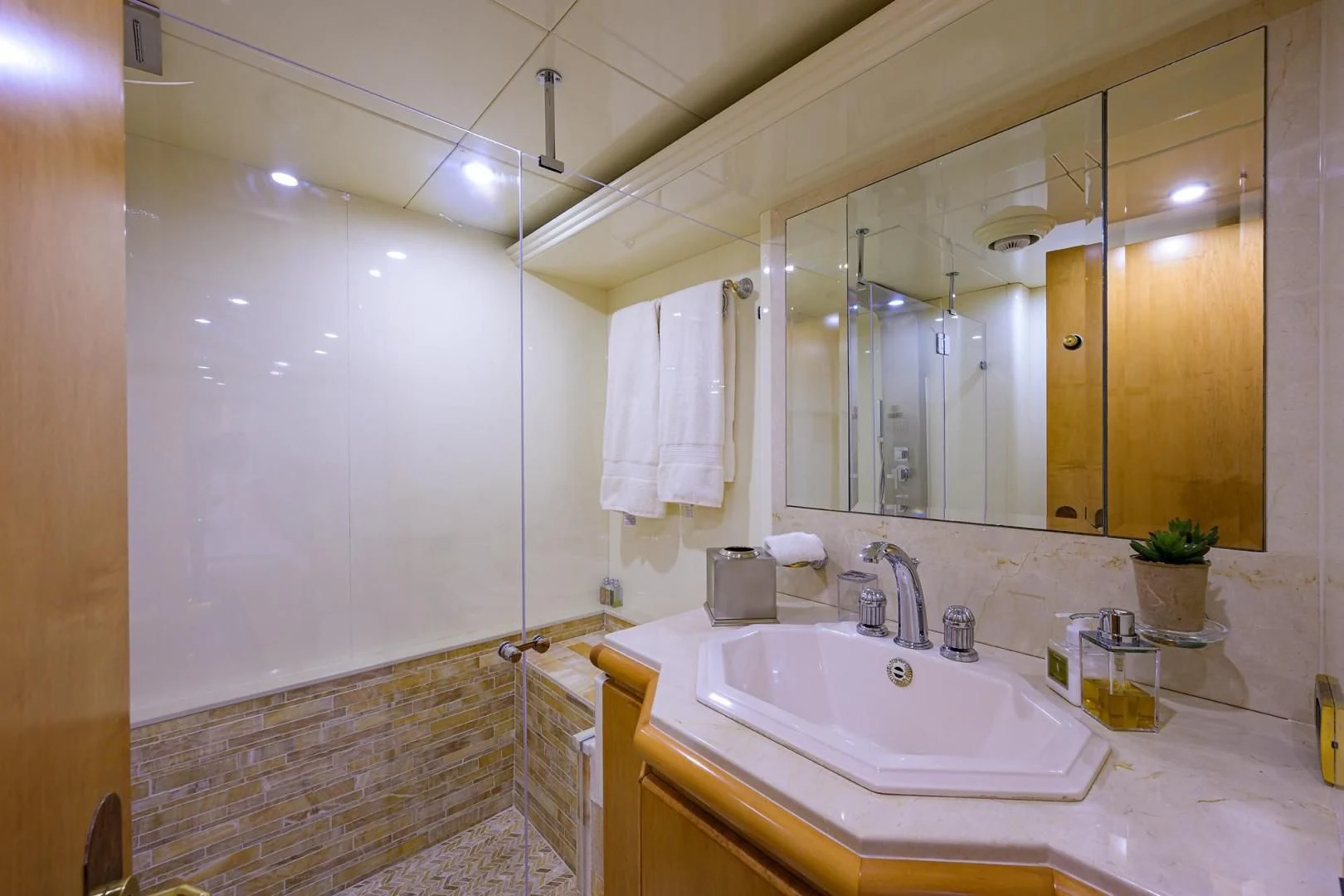 a bathroom with a large mirror aboard CABERNET Yacht for Sale