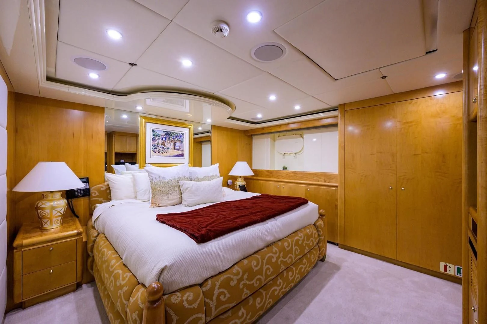 a large bed in a room aboard CABERNET Yacht for Sale