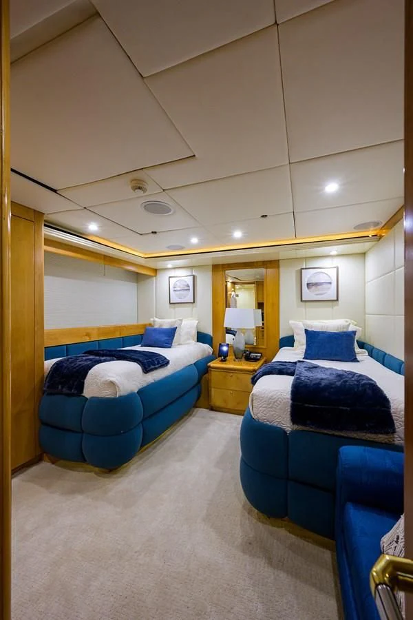 a room with a couple beds aboard CABERNET Yacht for Sale