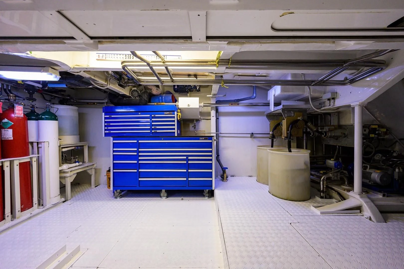 a warehouse with blue containers aboard CABERNET Yacht for Sale