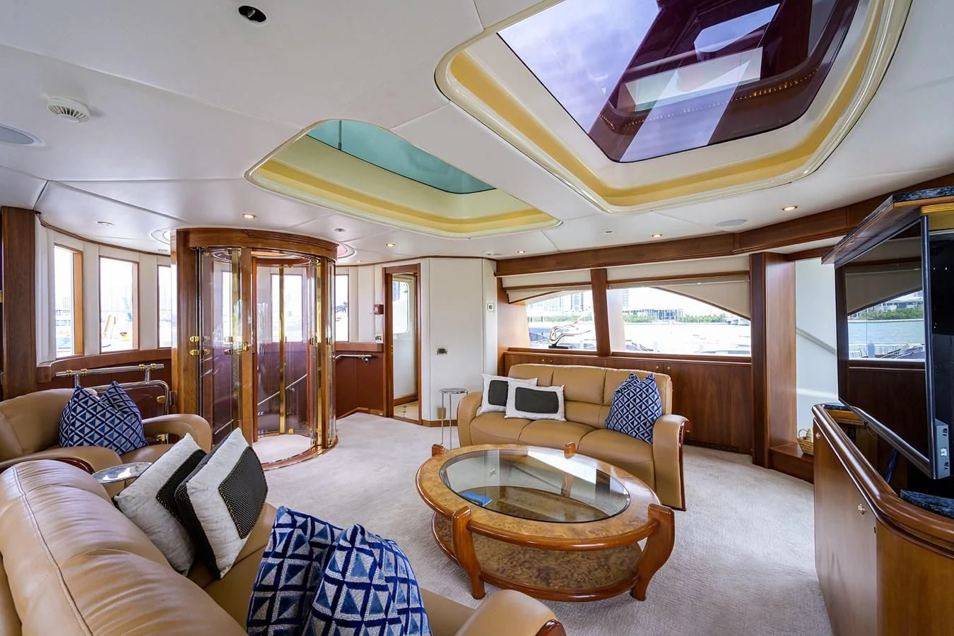 a living room with a table and chairs aboard CABERNET Yacht for Sale