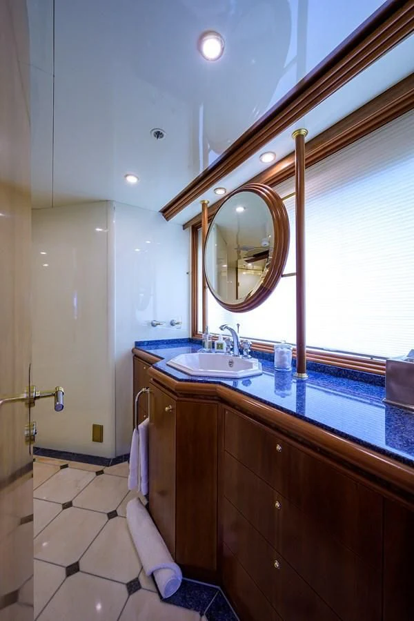 a bathroom with a sink and a mirror aboard CABERNET Yacht for Sale