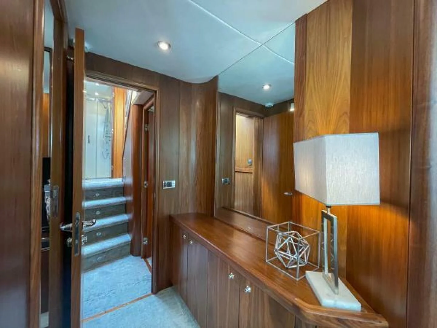 a bathroom with wood cabinets aboard TWINS Yacht for Sale