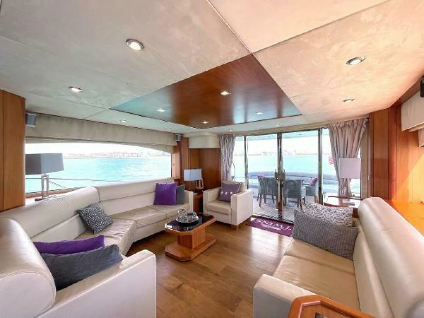 a living room with a large window aboard TWINS Yacht for Sale