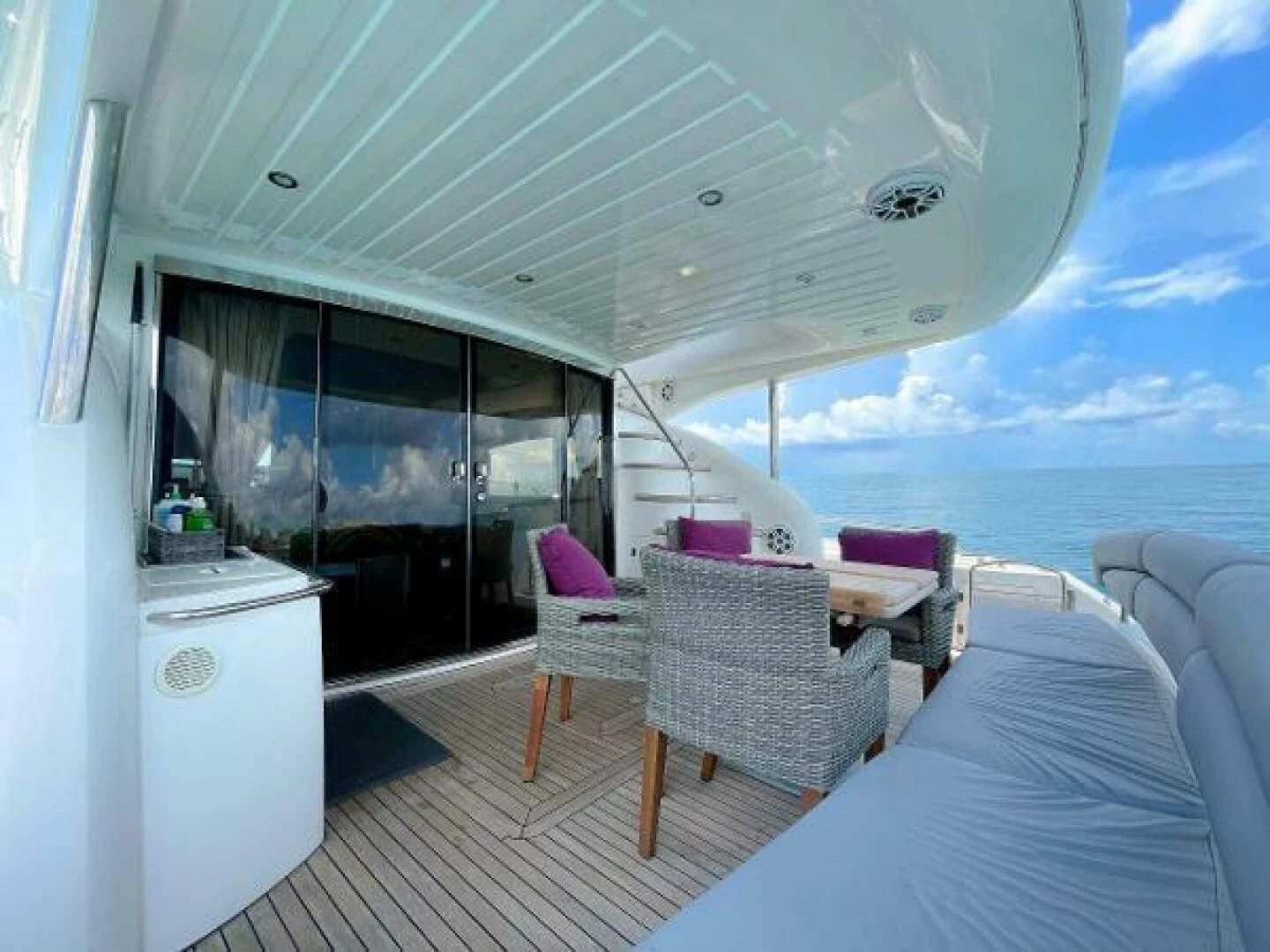 a room with a bed and a large window aboard TWINS Yacht for Sale