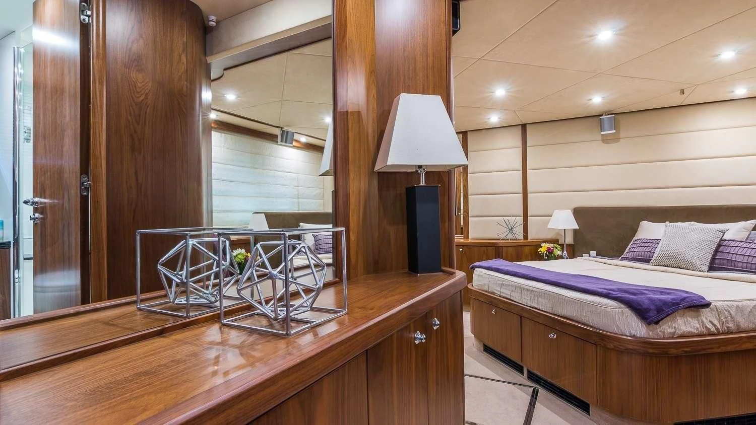 a bed and a table in a room aboard TWINS Yacht for Sale