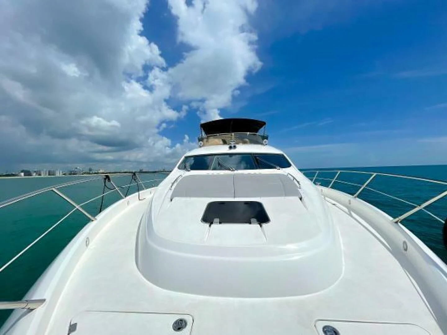 a white car on a road aboard TWINS Yacht for Sale