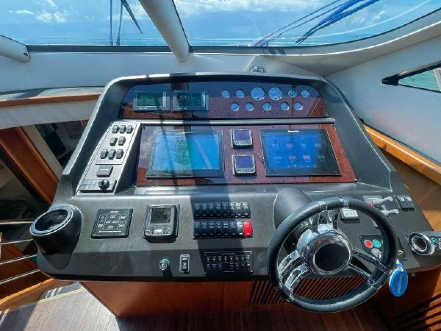 a car with a screen and buttons aboard TWINS Yacht for Sale