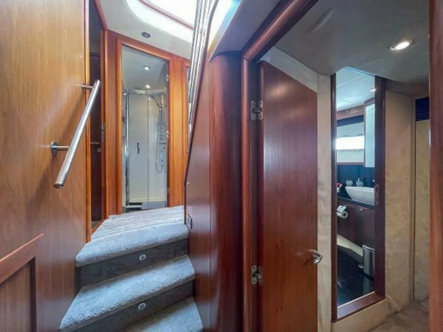 a wood door with a bench aboard TWINS Yacht for Sale