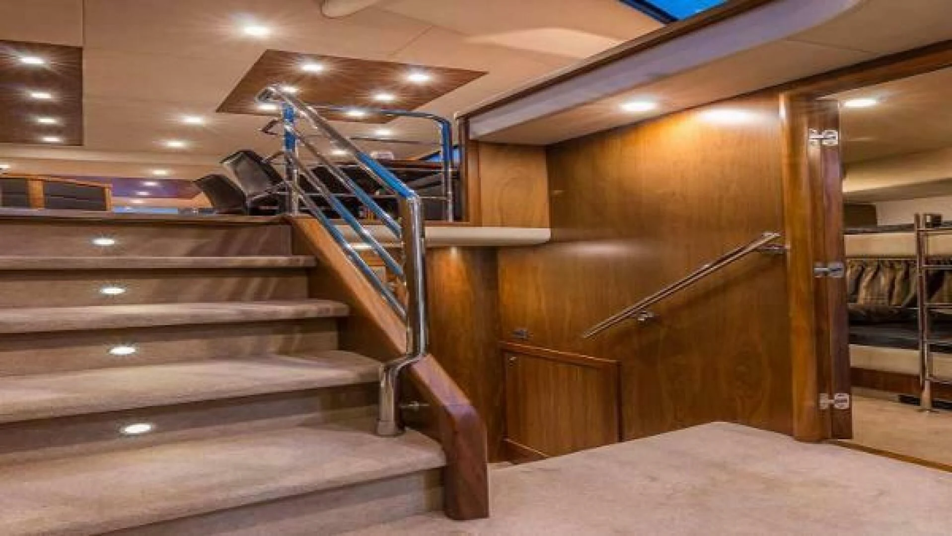 a wooden staircase in a building aboard TWINS Yacht for Sale