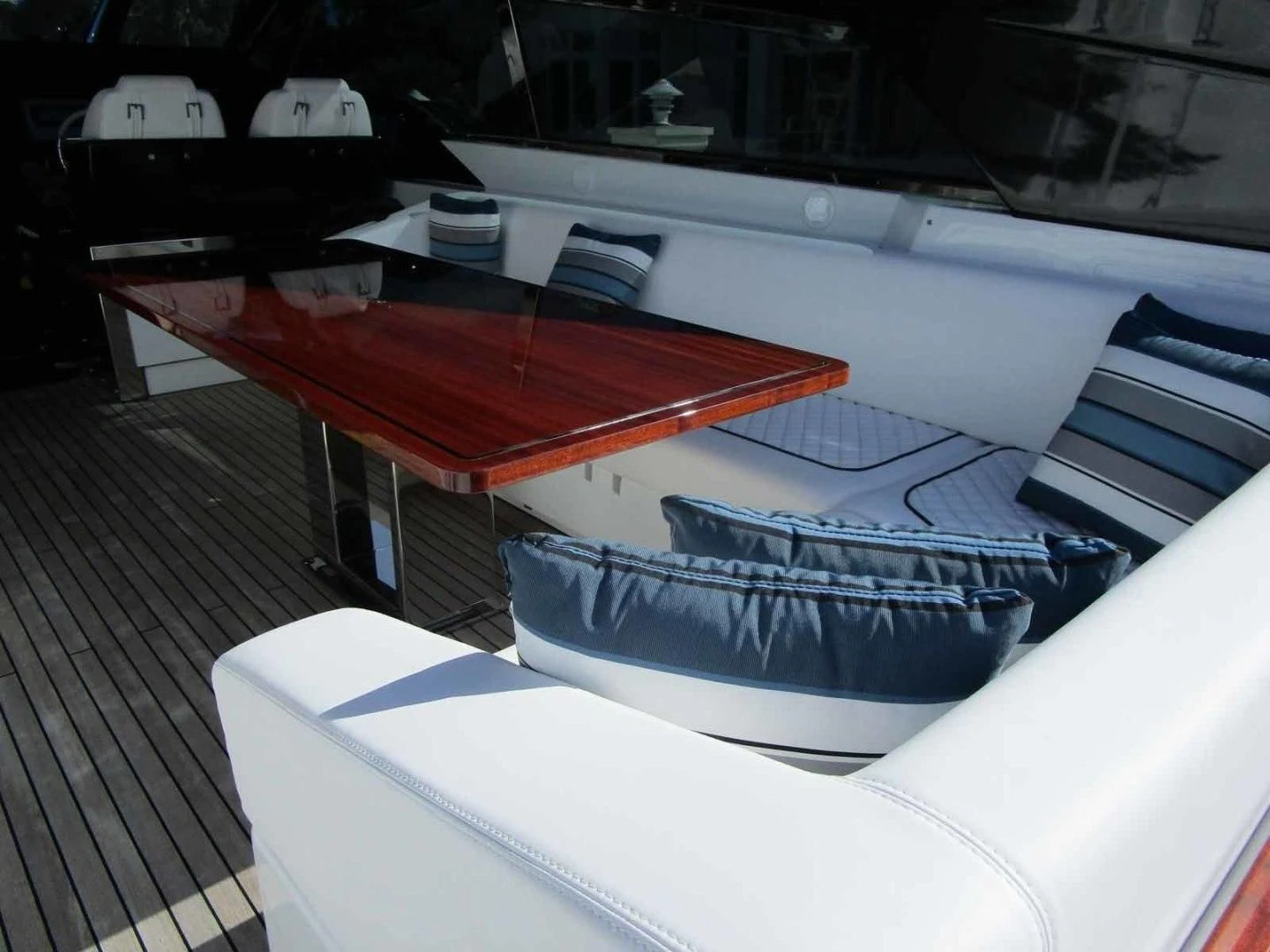 a row of white and black seats aboard REGENCY Yacht for Sale