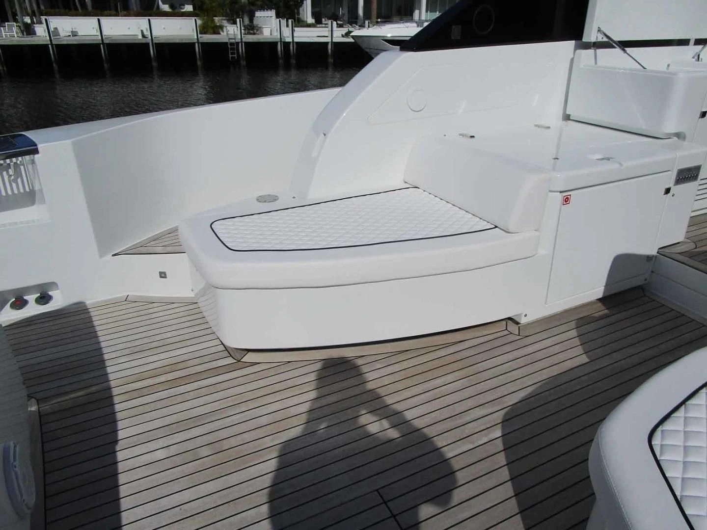 a white car with a black stripe aboard REGENCY Yacht for Sale