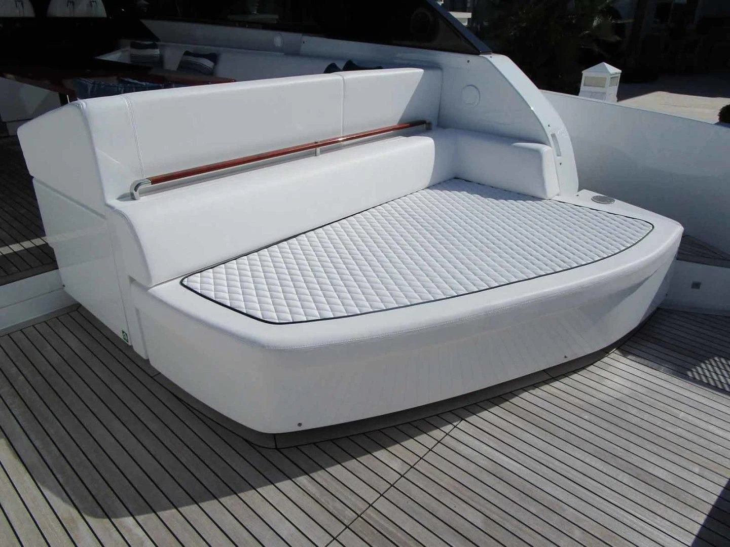 a white car with a red stripe aboard REGENCY Yacht for Sale