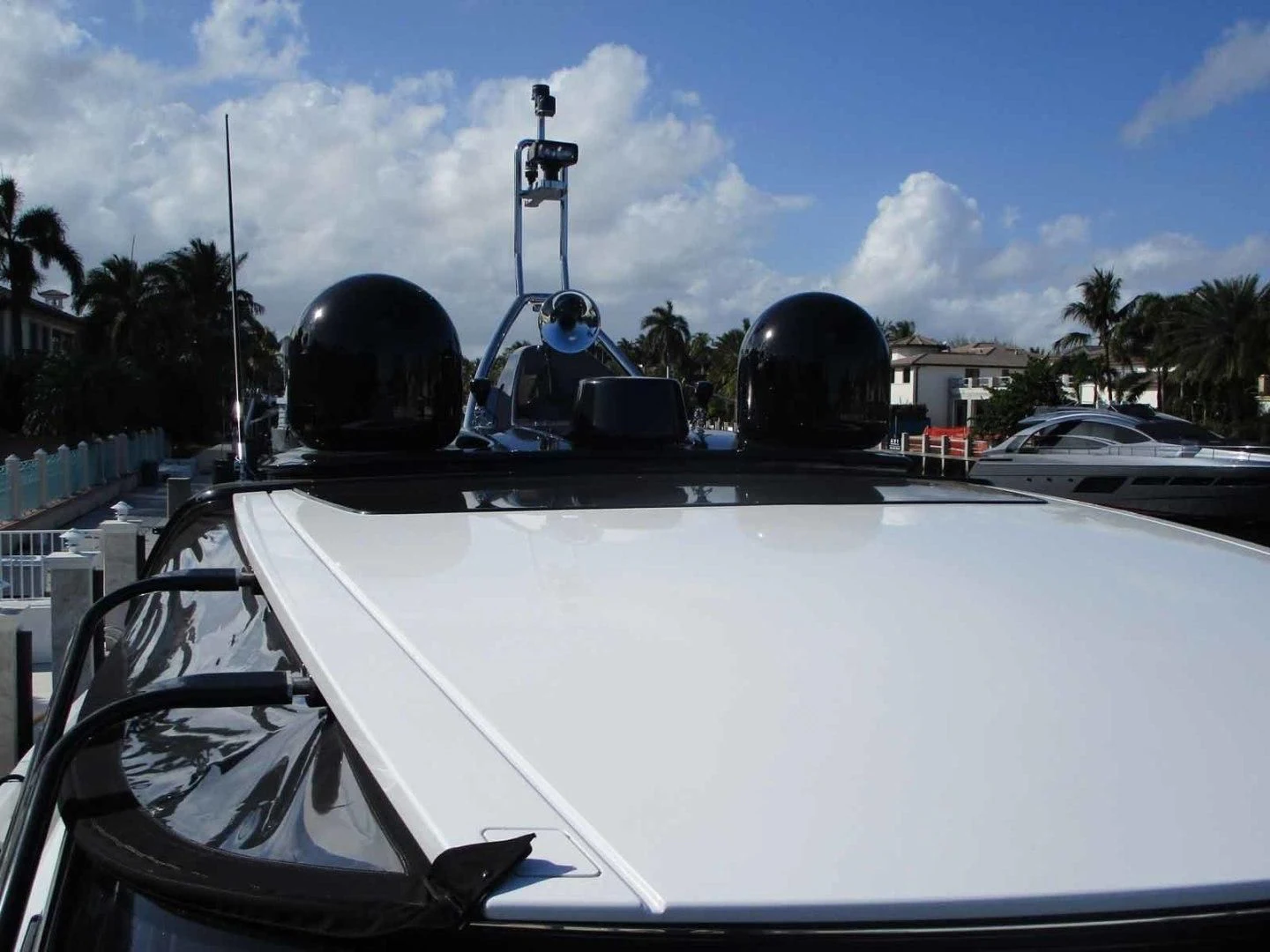 a person driving a white car aboard REGENCY Yacht for Sale
