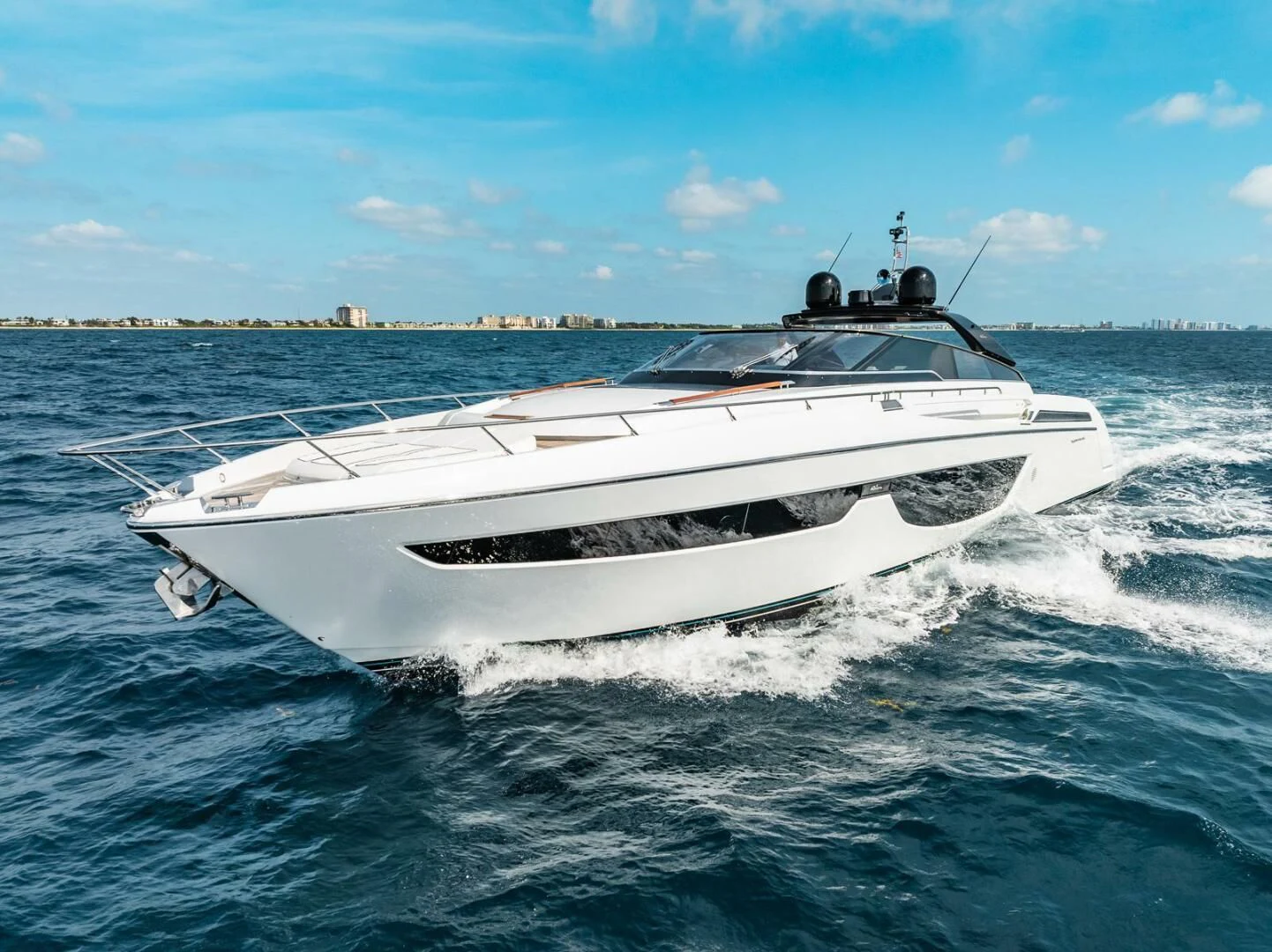 a white yacht on the water aboard REGENCY Yacht for Sale
