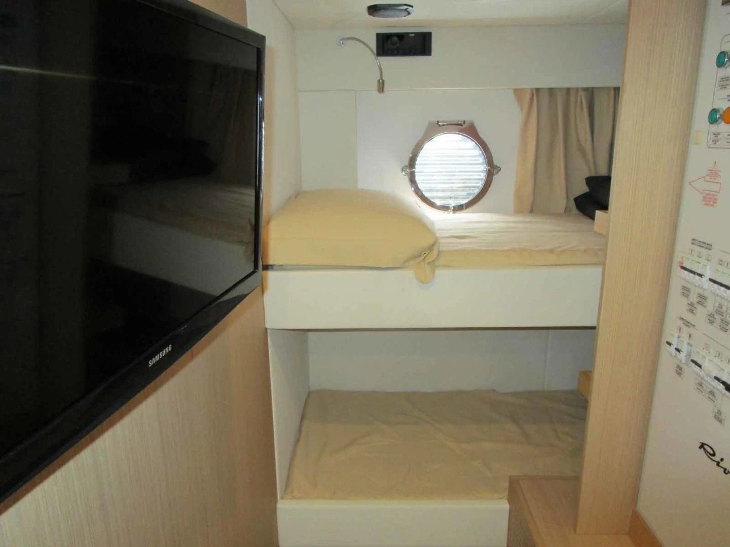 a microwave oven and a bed in a room aboard REGENCY Yacht for Sale