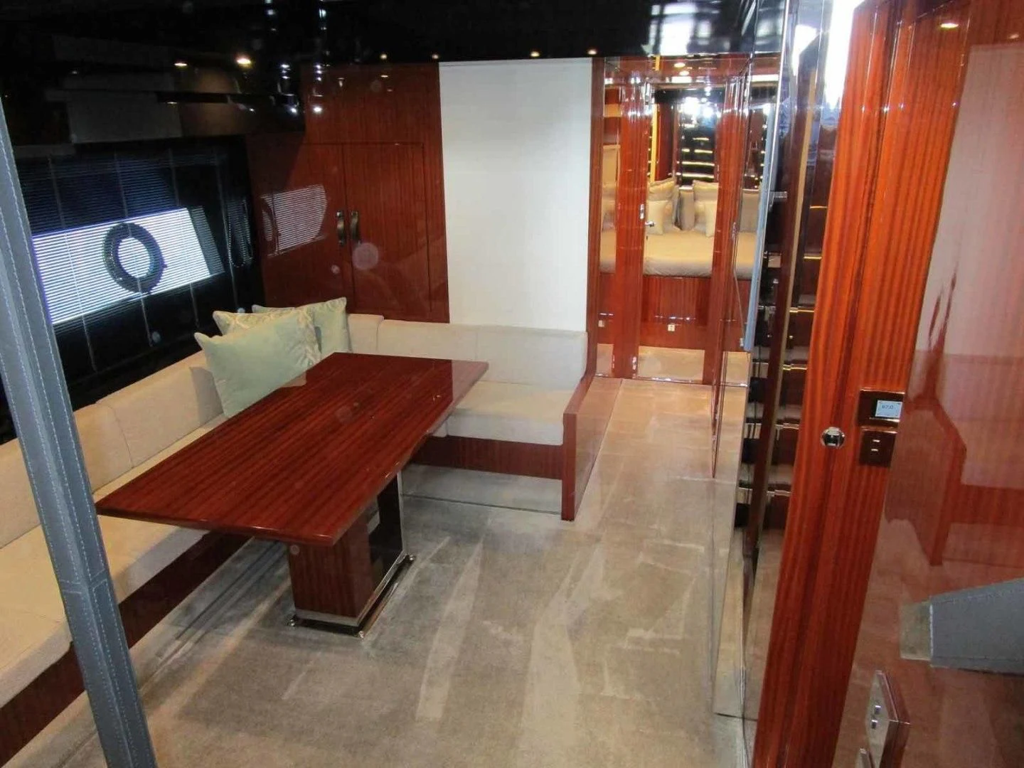 a room with a bench and a table aboard REGENCY Yacht for Sale