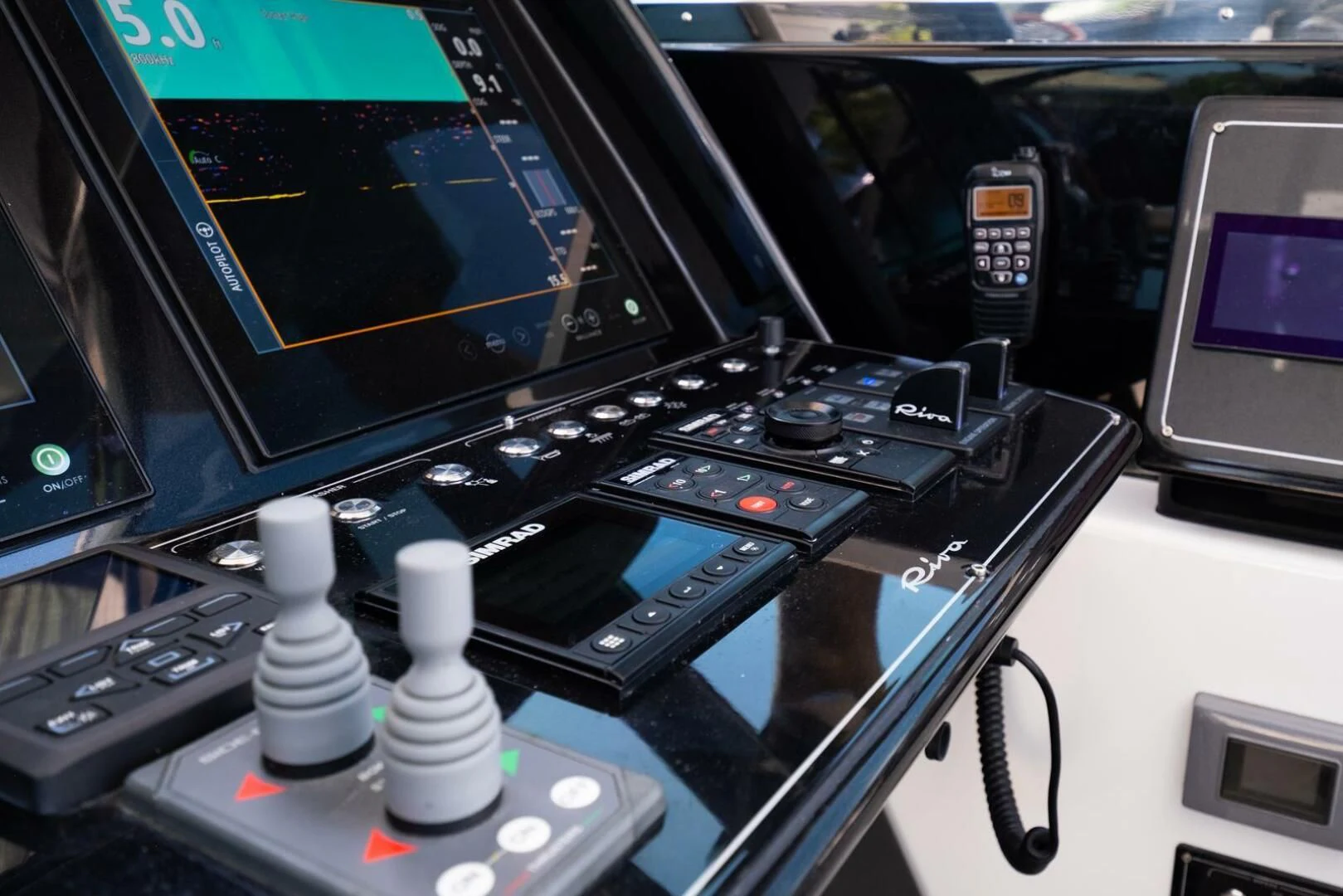 a control panel with a computer and other electronic devices aboard REGENCY Yacht for Sale