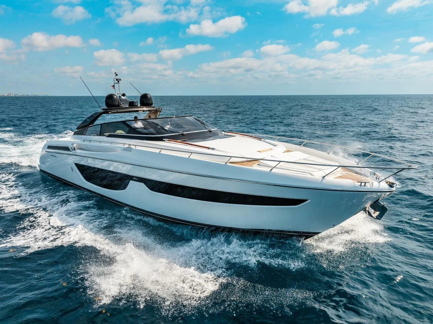 a white yacht on the water aboard REGENCY Yacht for Sale