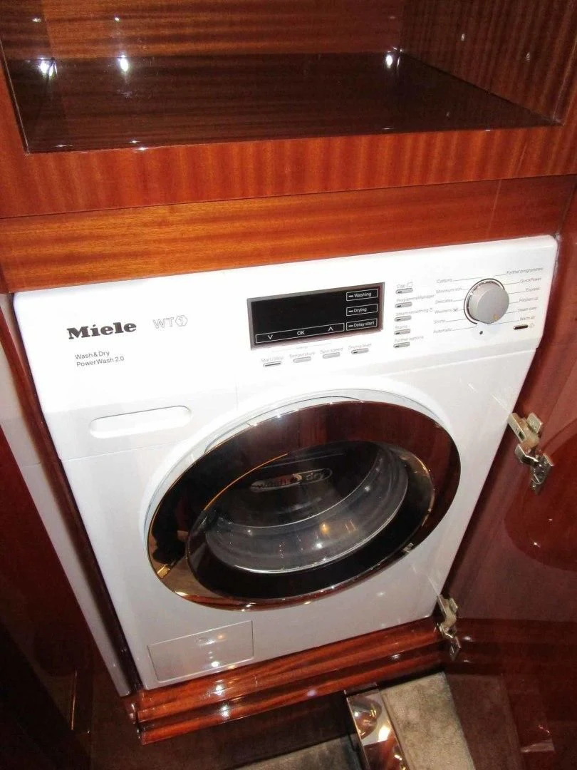 a white stove with a black burner aboard REGENCY Yacht for Sale