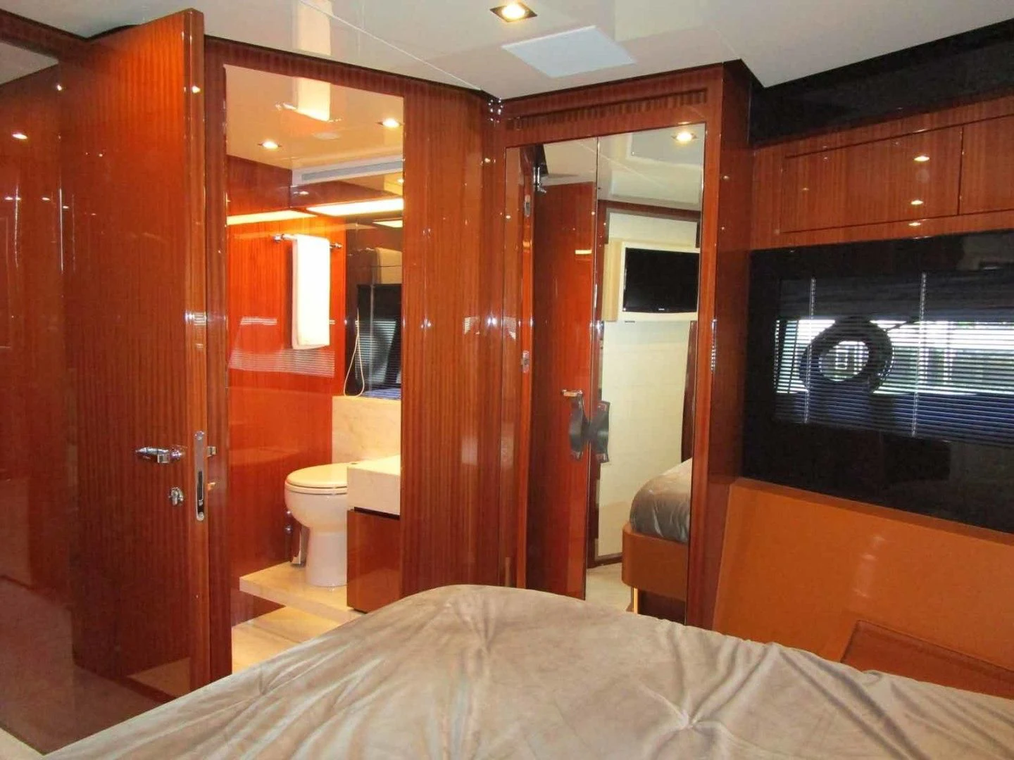 a bedroom with a wood closet aboard REGENCY Yacht for Sale