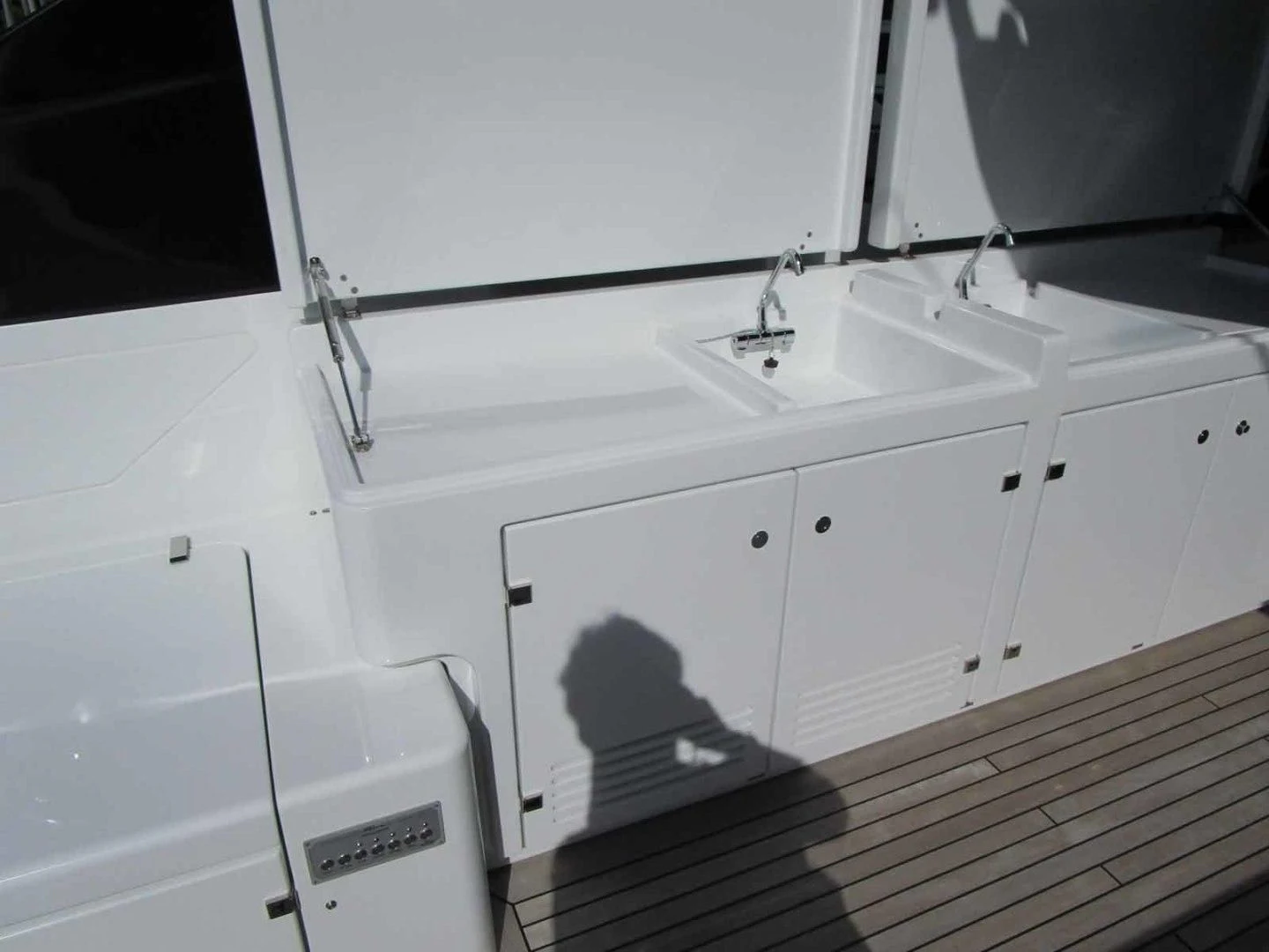 a white sink with a faucet aboard REGENCY Yacht for Sale