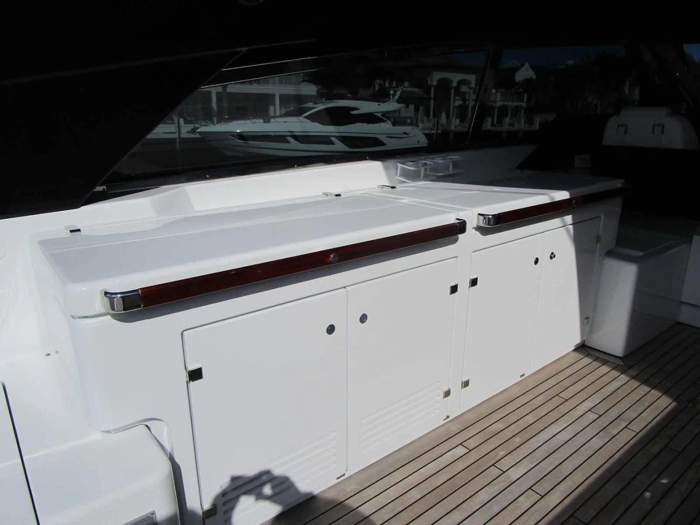a kitchen with white cabinets aboard REGENCY Yacht for Sale