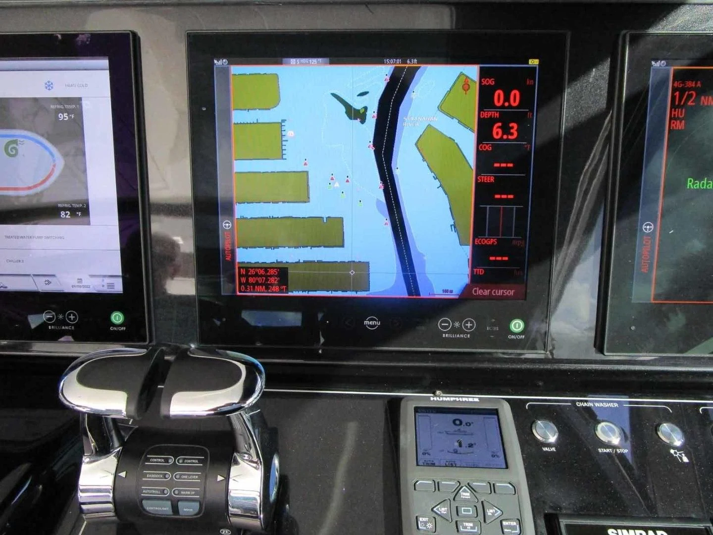 a screen with a screen and a phone on it aboard REGENCY Yacht for Sale