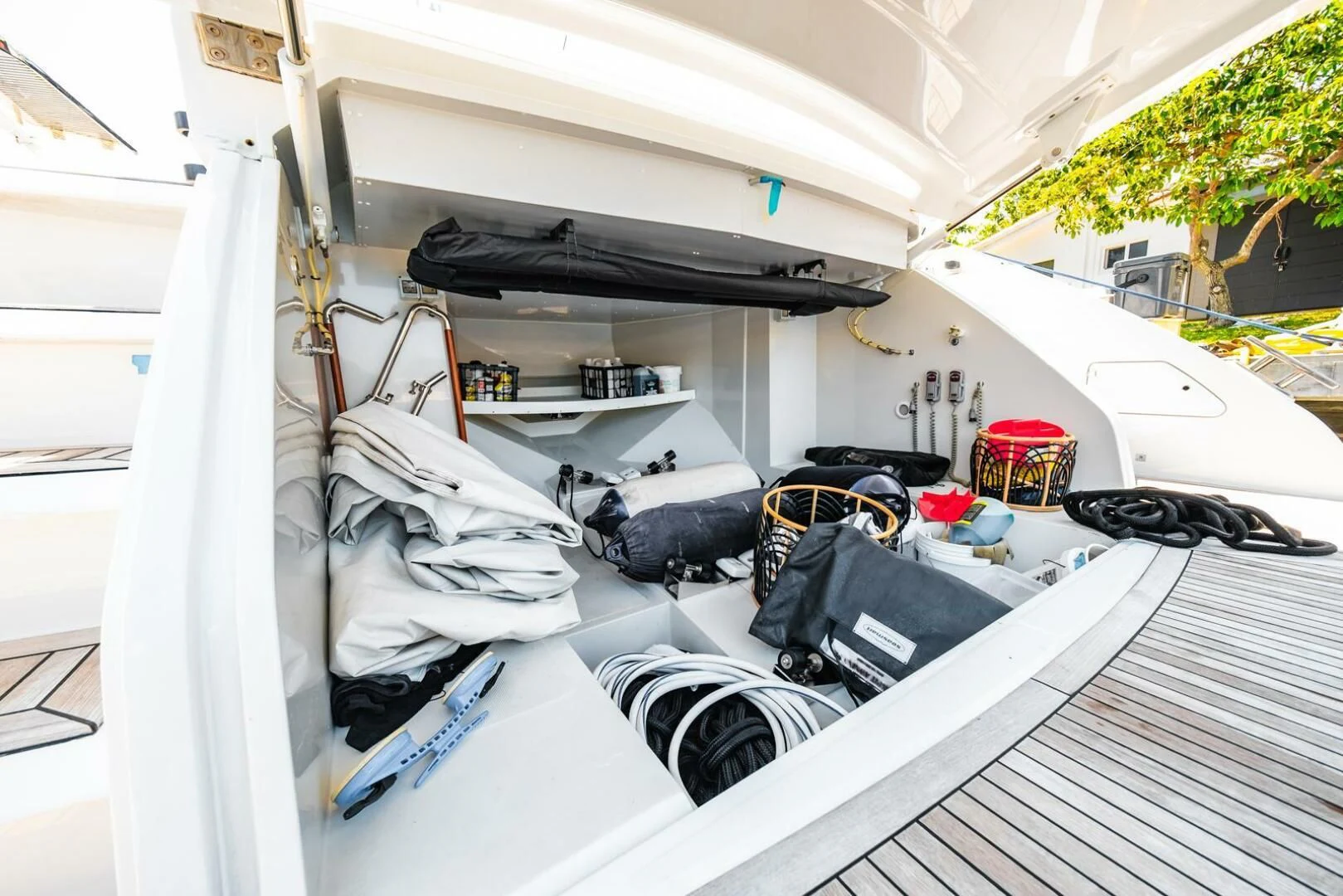 a white tent with a black and white car inside aboard REGENCY Yacht for Sale