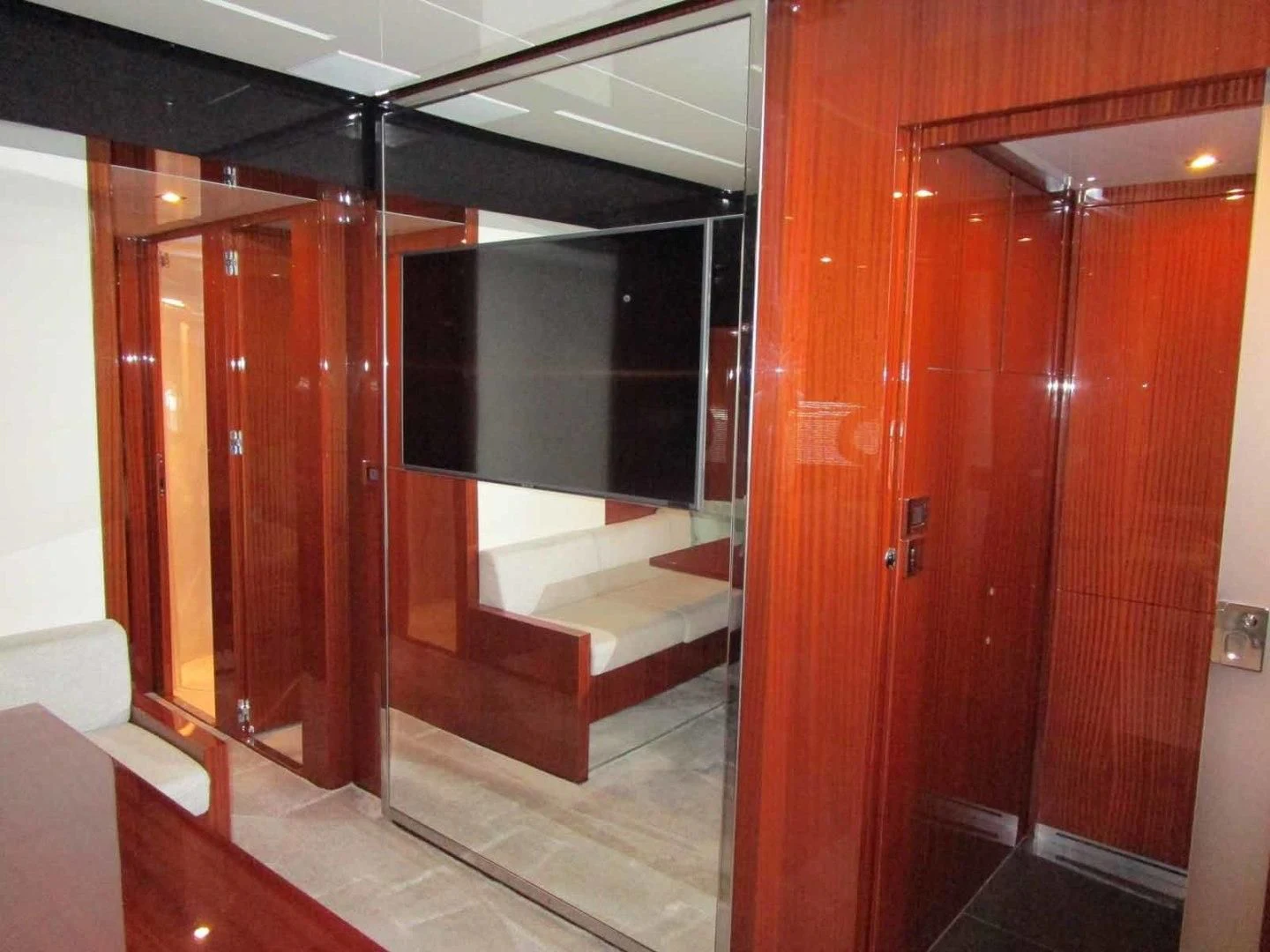 a room with wooden doors aboard REGENCY Yacht for Sale