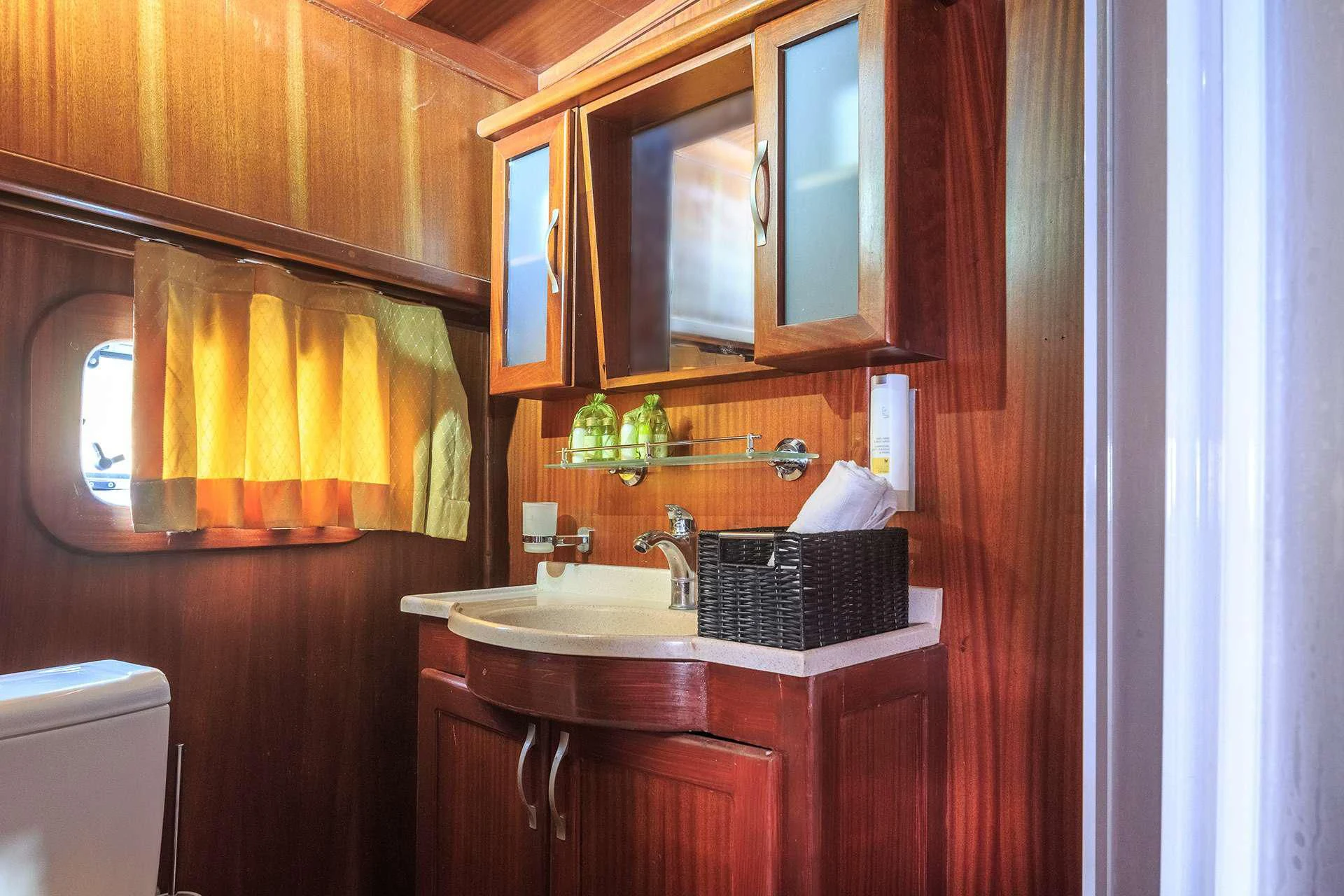 a bathroom with a sink and cabinets aboard ALLURE E Yacht for Sale