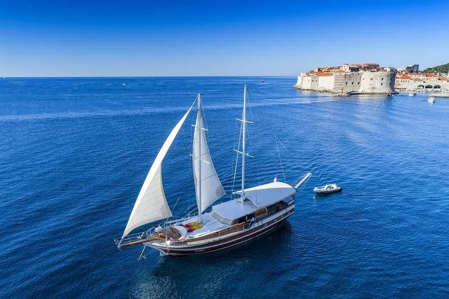 a boat sailing on the water aboard ALLURE E Yacht for Sale