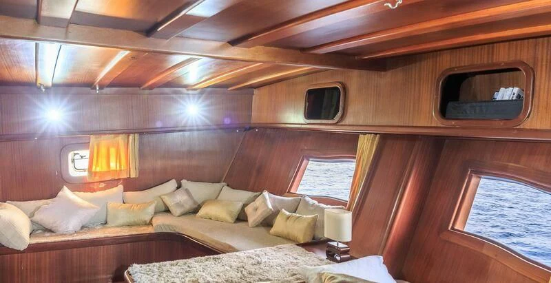a room with a bed and a window aboard ALLURE E Yacht for Sale