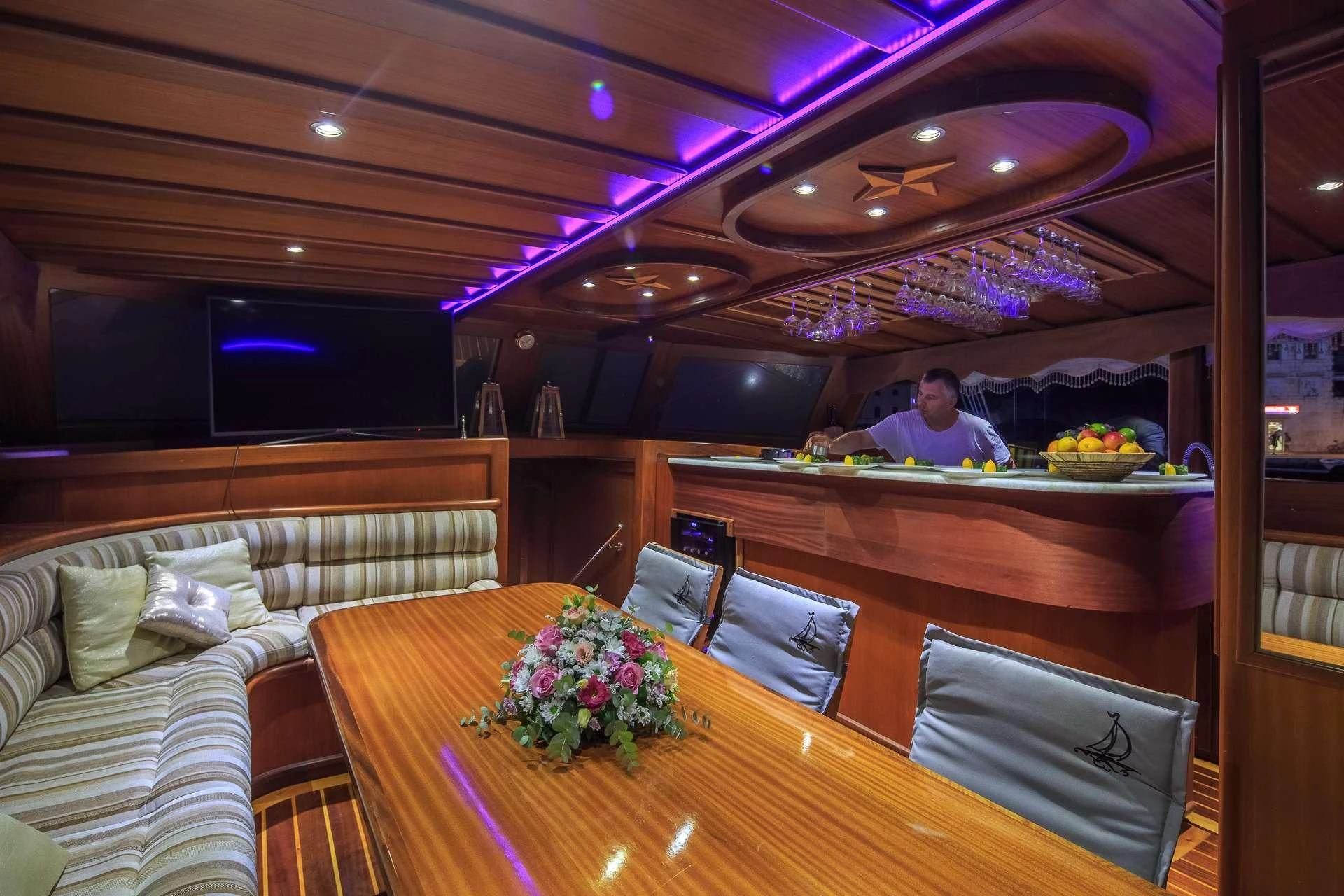 a person sitting at a table aboard ALLURE E Yacht for Sale