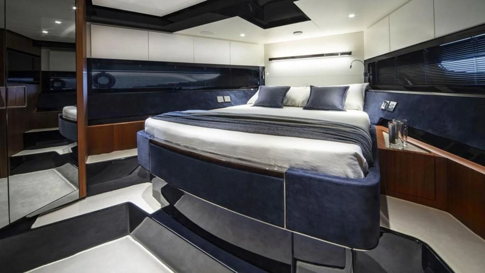 a bed in a room aboard RIVA 66' RIBELLE Yacht for Sale