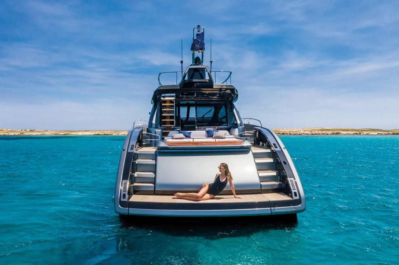 a person sitting on a boat aboard RIVA 66' RIBELLE Yacht for Sale