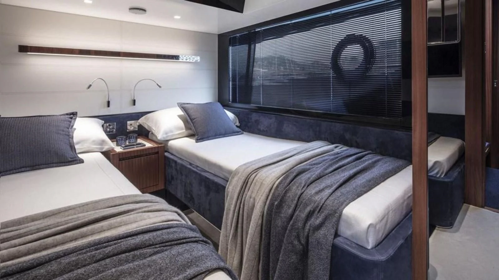 a couple of beds in a room aboard RIVA 66' RIBELLE Yacht for Sale