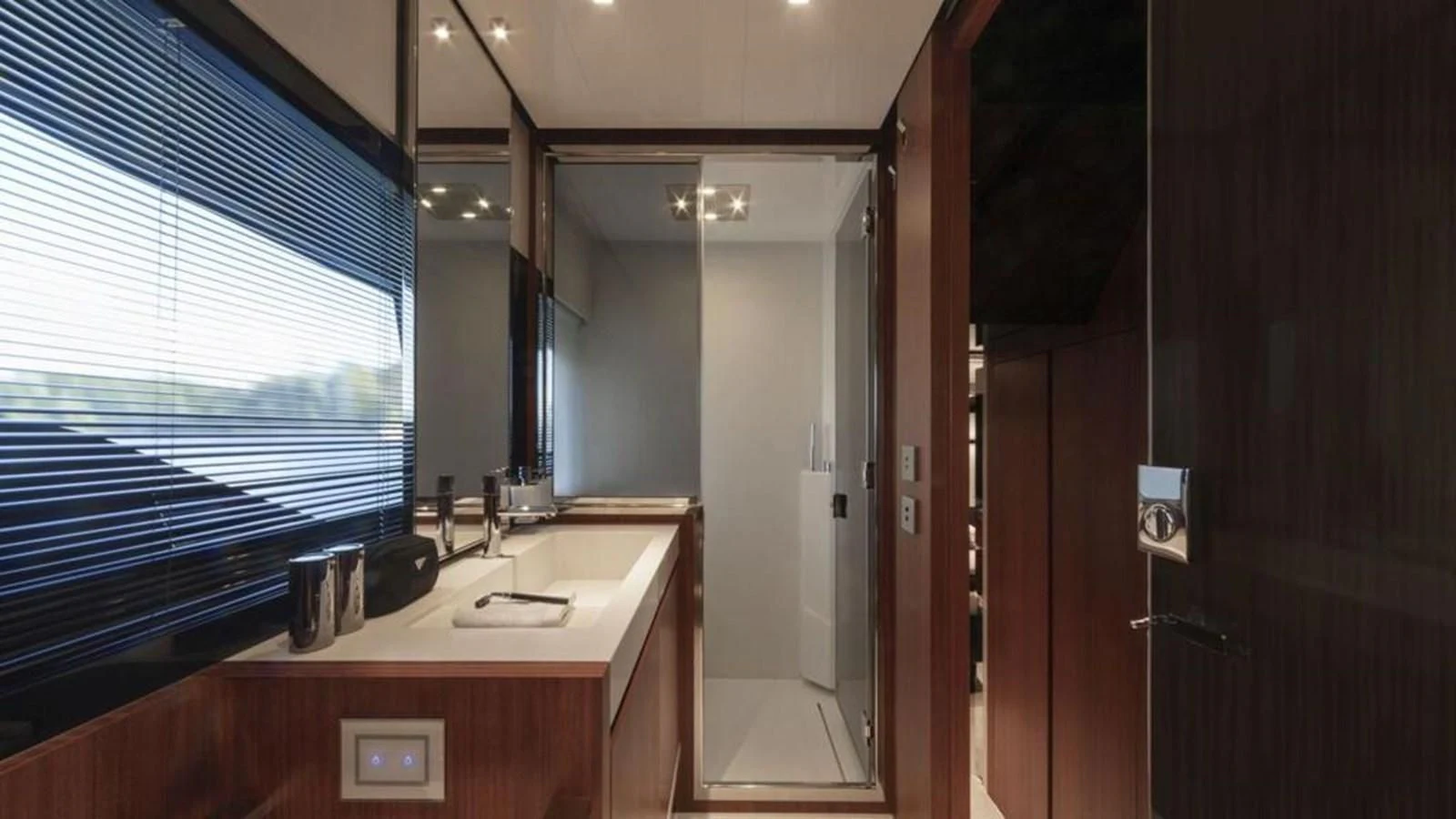 a bathroom with a sink and a mirror aboard RIVA 66' RIBELLE Yacht for Sale