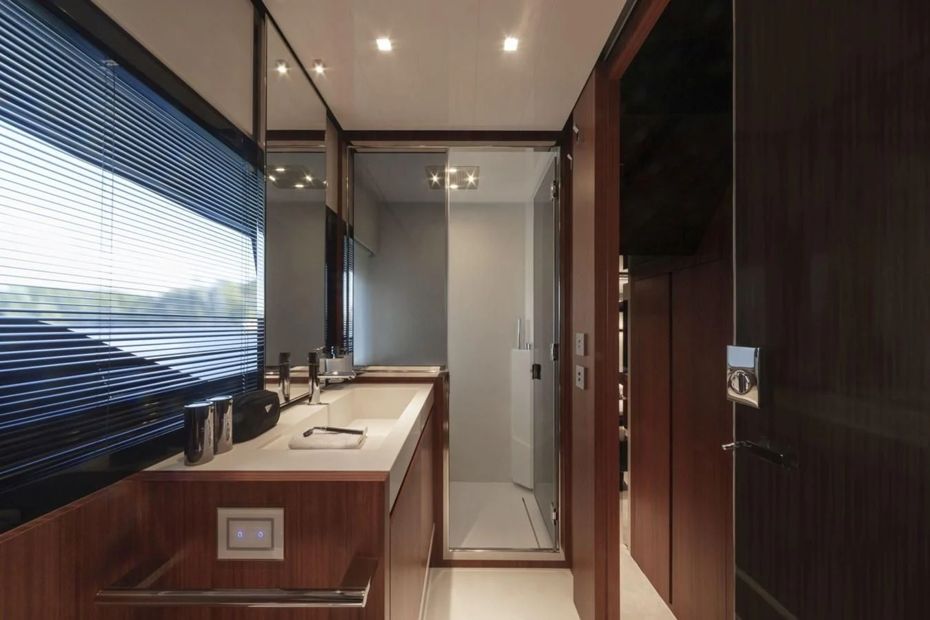 a bathroom with a countertop sink and a mirror aboard RIVA 66' RIBELLE Yacht for Sale