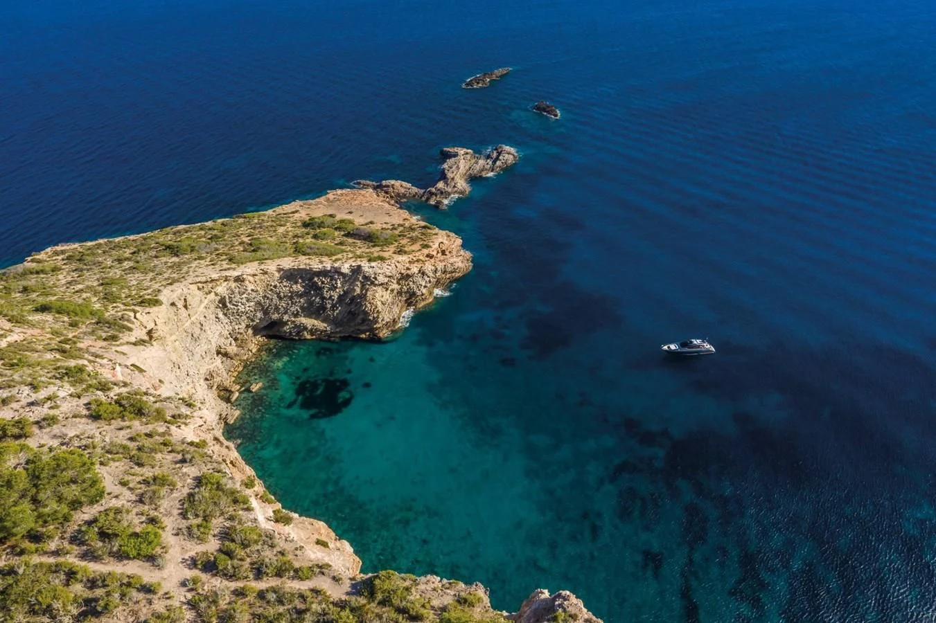 a rocky coast line aboard RIVA 66' RIBELLE Yacht for Sale