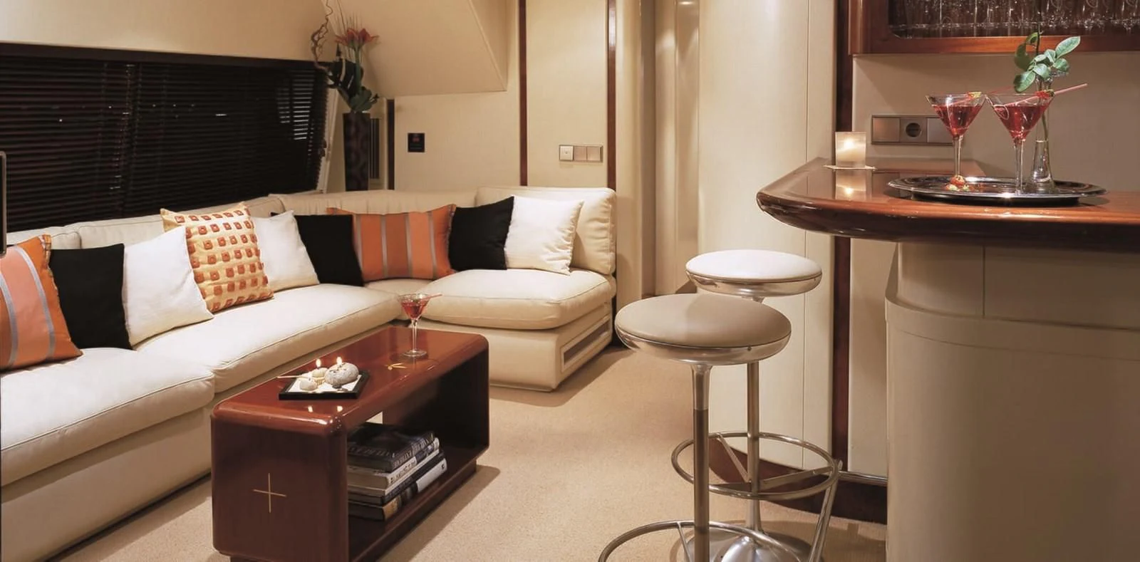 a living room with a white couch and a coffee table aboard COSTA MAGNA Yacht for Sale