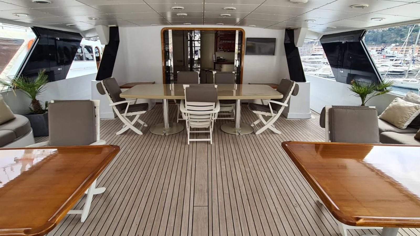 a room with tables and chairs aboard COSTA MAGNA Yacht for Sale