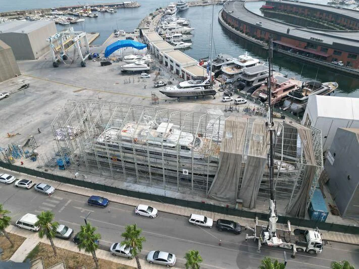 a large building with boats parked in it aboard COSTA MAGNA Yacht for Sale