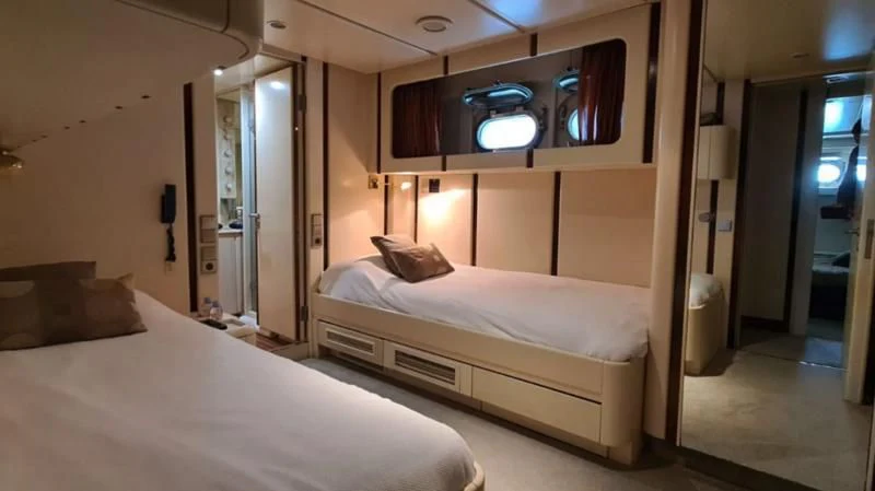 a room with two beds aboard COSTA MAGNA Yacht for Sale