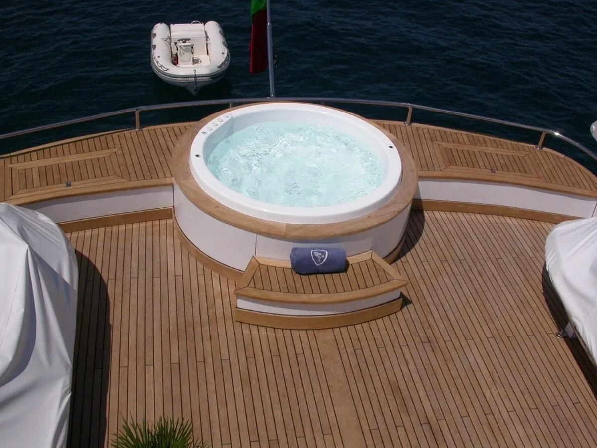a round white object on a wooden surface aboard COSTA MAGNA Yacht for Sale