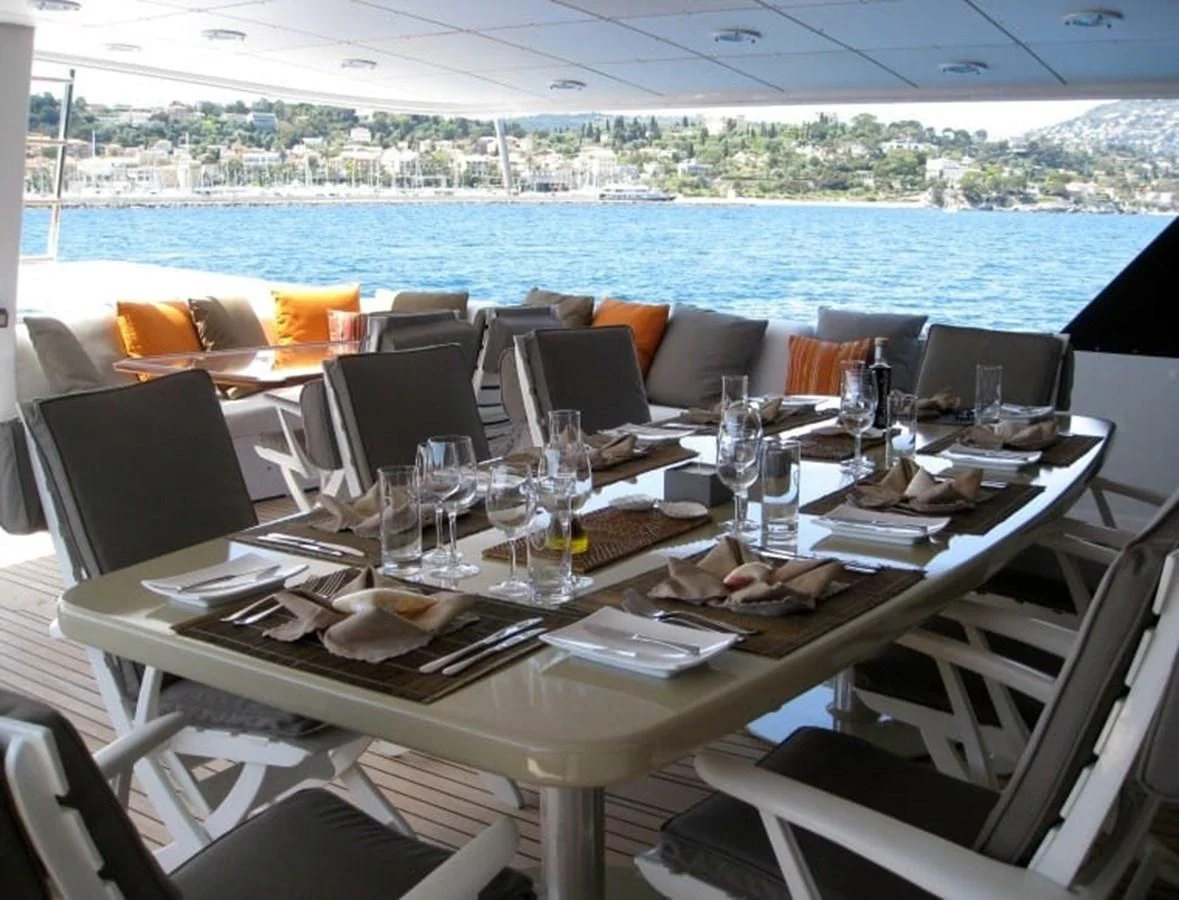 a table set for a dinner aboard COSTA MAGNA Yacht for Sale
